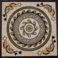 Intricate mosaic art featuring a central spiral design with colorful fish and floral motifs — crafted from natural stone tiles.