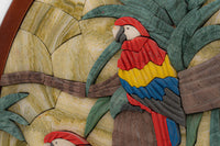 Vibrant wooden wall art featuring colorful parrots perched on lush green palm leaves — intricately carved with detailed textures.