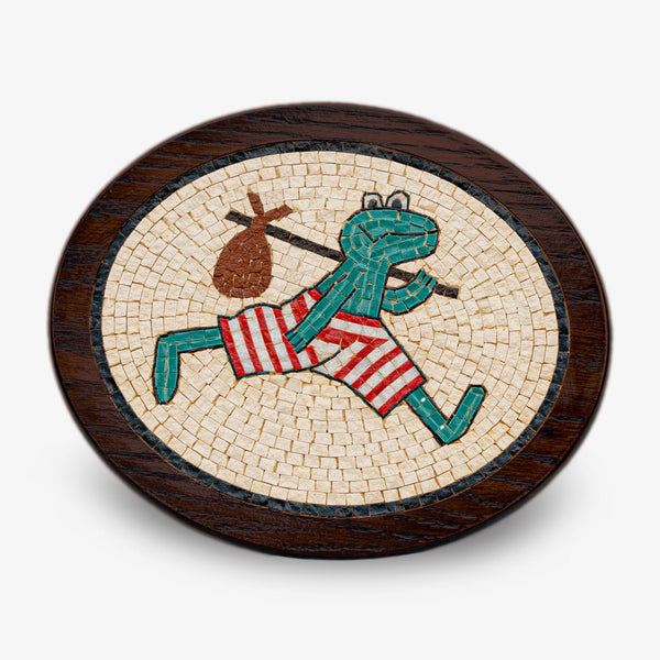 Colorful mosaic frog figurine with striped shorts, set against a dark wooden base — playful design adds charm to decor