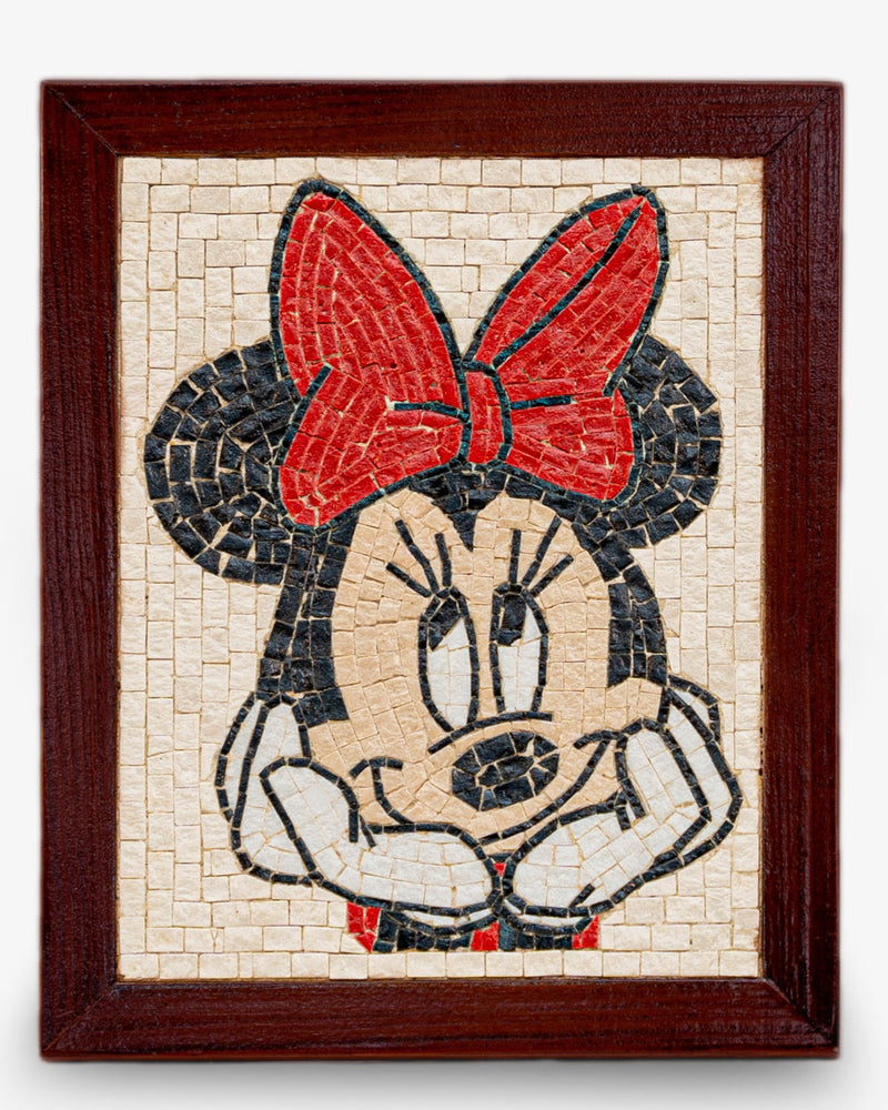Handcrafted mosaic art featuring Minnie Mouse with a vibrant red bow — detailed stonework framed in dark wood