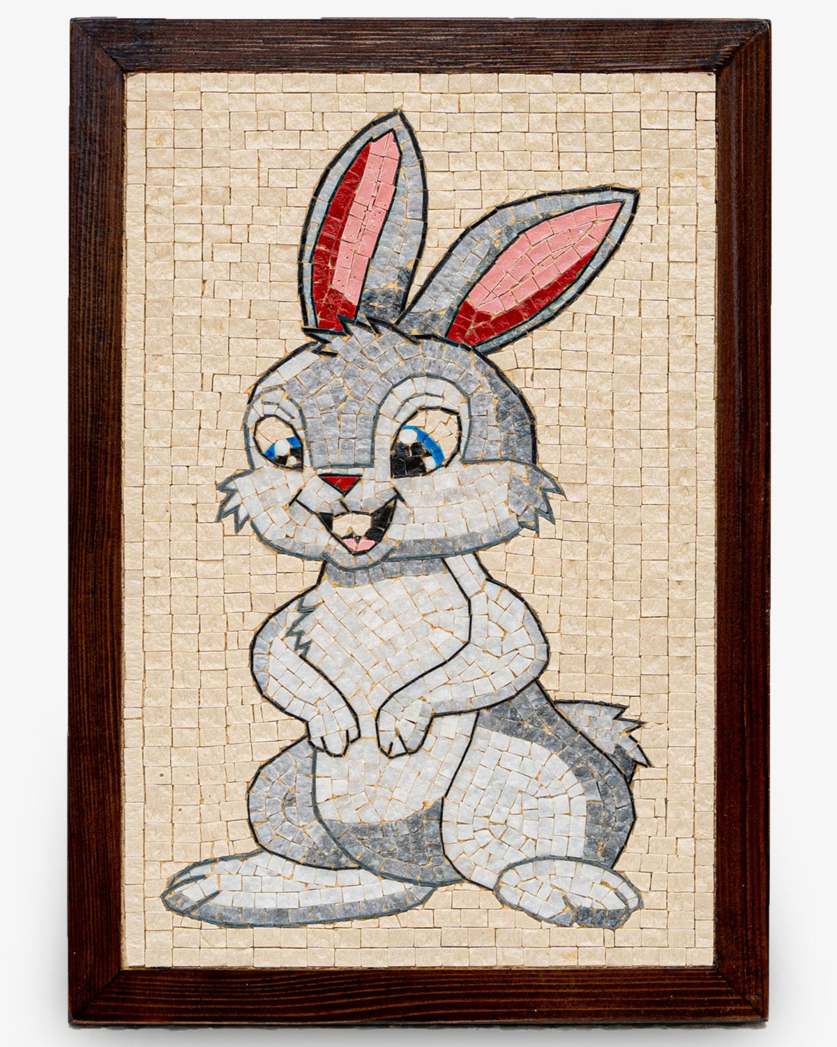 Charming mosaic art featuring a playful grey rabbit with pink ears, set in a wooden frame for a whimsical touch