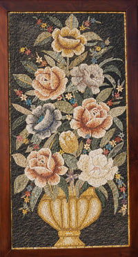 Intricate floral mosaic wall art featuring a bouquet of roses in soft tones set against a dark background — elegant craftsmanship with natural stone.