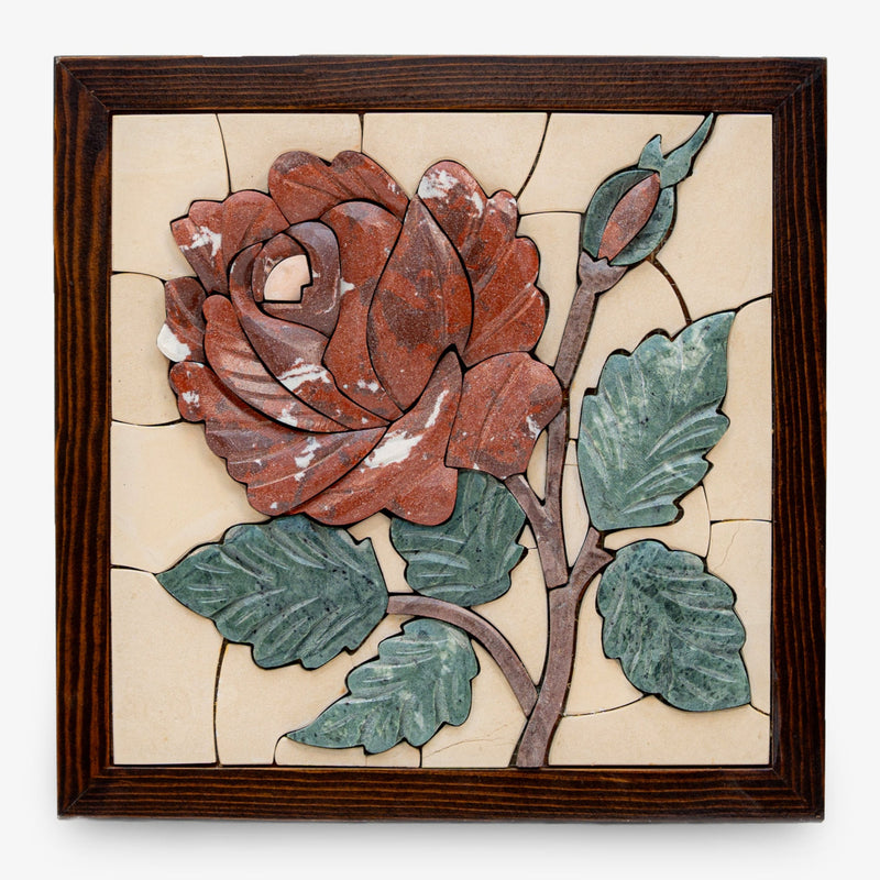Intricate floral wall art featuring a red rose with green leaves, set in a textured cream background and framed in dark wood.