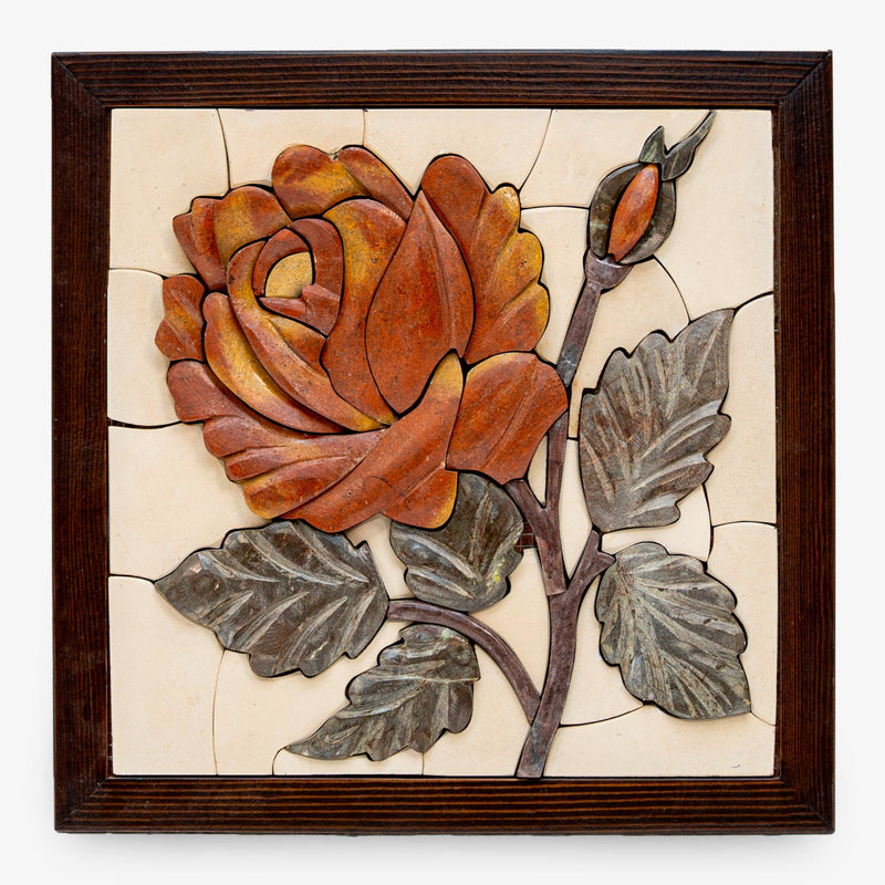 Intricate wall art featuring a vibrant orange rose crafted from ceramic and metal with detailed leaves and a wooden frame