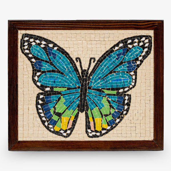 Colorful mosaic butterfly wall art featuring vibrant blue and green tiles set in a dark wooden frame