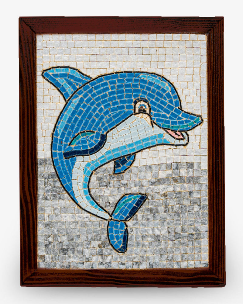 Colorful dolphin mosaic artwork framed in dark wood — vibrant blue tiles create a playful marine scene.