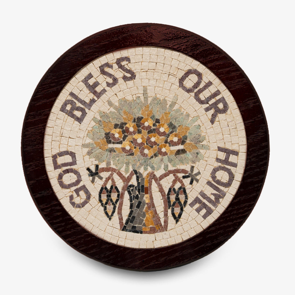 Artistic mosaic plaque featuring a floral design with the words 'Bless Our Home' encircled in earthy tones on a wooden base