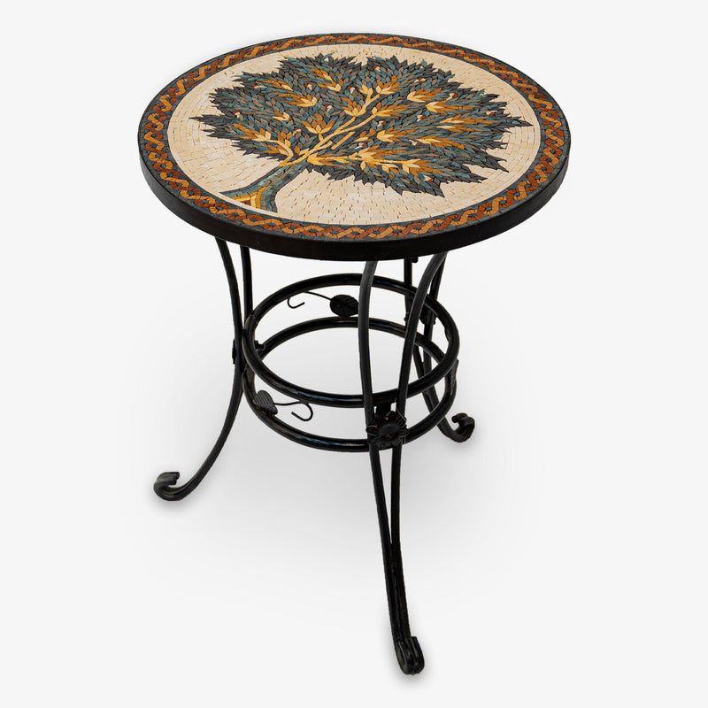 Artistic mosaic side table featuring a tree design on a round top with intricate detailing and a sturdy black metal base