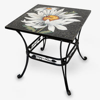 Elegant mosaic side table with a floral design in black and white — featuring a sturdy wrought iron base.