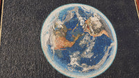 Intricate mosaic art depicting the Earth with vibrant blue oceans and detailed landmasses — a unique decorative piece for any space.