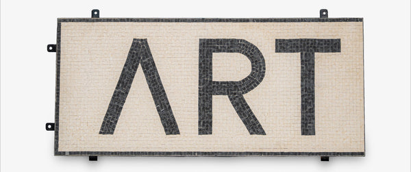 Decorative wall art with 'ART' and a lambda symbol on a white background