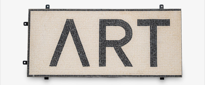 Decorative wall art with 'ART' and a lambda symbol on a white background
