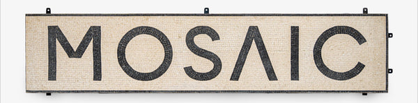 Mosaic sign with black text on a beige background