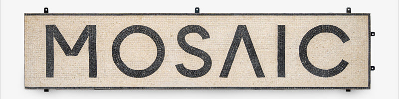 Mosaic sign with black text on a beige background