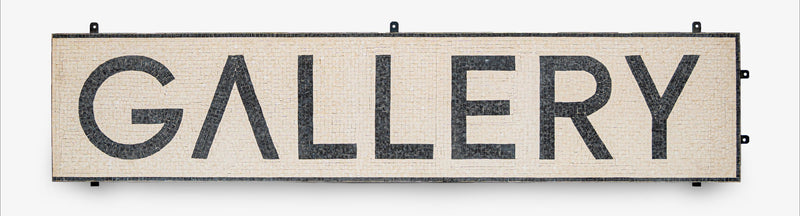 Wooden sign with 'GALLERY' text on a white background