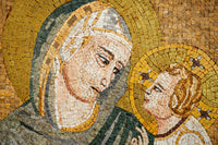Intricate mosaic artwork depicting a serene Virgin Mary with a gentle expression and a child, featuring vibrant golds and earthy tones.