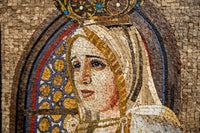 Intricate mosaic artwork depicting a serene figure with a crown — crafted from colorful tiles and natural stone textures.
