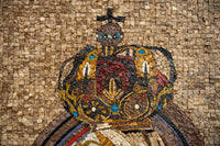 Intricate mosaic artwork featuring a regal crown adorned with vibrant colors and detailed patterns on a textured stone background
