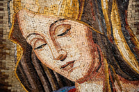 Intricate mosaic artwork featuring a serene face with golden hair and warm tones, highlighting exquisite craftsmanship in detail.