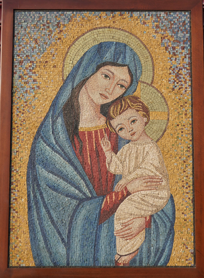 Intricate mosaic artwork depicting a serene Virgin Mary holding the Christ child, with vibrant blue and gold tones.