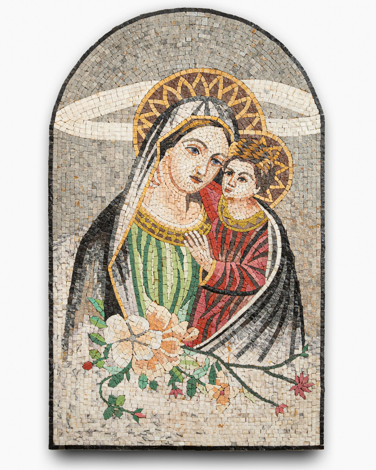 Intricate mosaic artwork depicting a mother and child, featuring vibrant green and red details with floral accents.