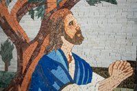 Intricate mosaic artwork depicting a man with a beard in a blue robe, set against a textured tree background.
