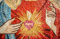 Intricate mosaic art depicting a vibrant red heart surrounded by golden rays — a striking display of craftsmanship and color.