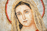Intricate mosaic artwork depicting a serene figure with soft facial features and warm earth-toned tiles in a circular pattern.