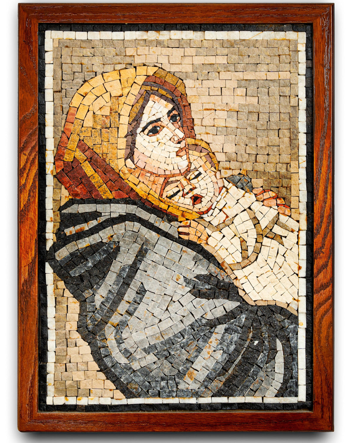 Intricate mosaic artwork depicting a mother holding her child, framed in rich wooden borders — detailed craftsmanship showcasing vibrant tiles.