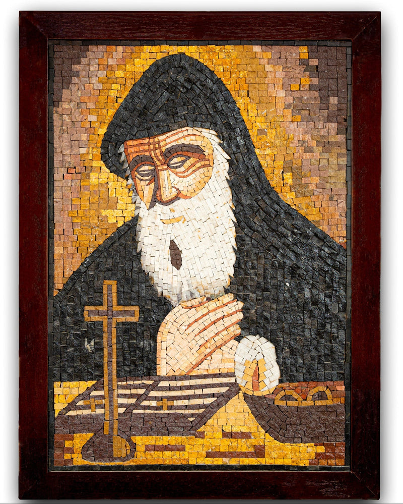 Intricate mosaic artwork depicting a serene figure in a dark robe with a white beard, framed in rich mahogany.