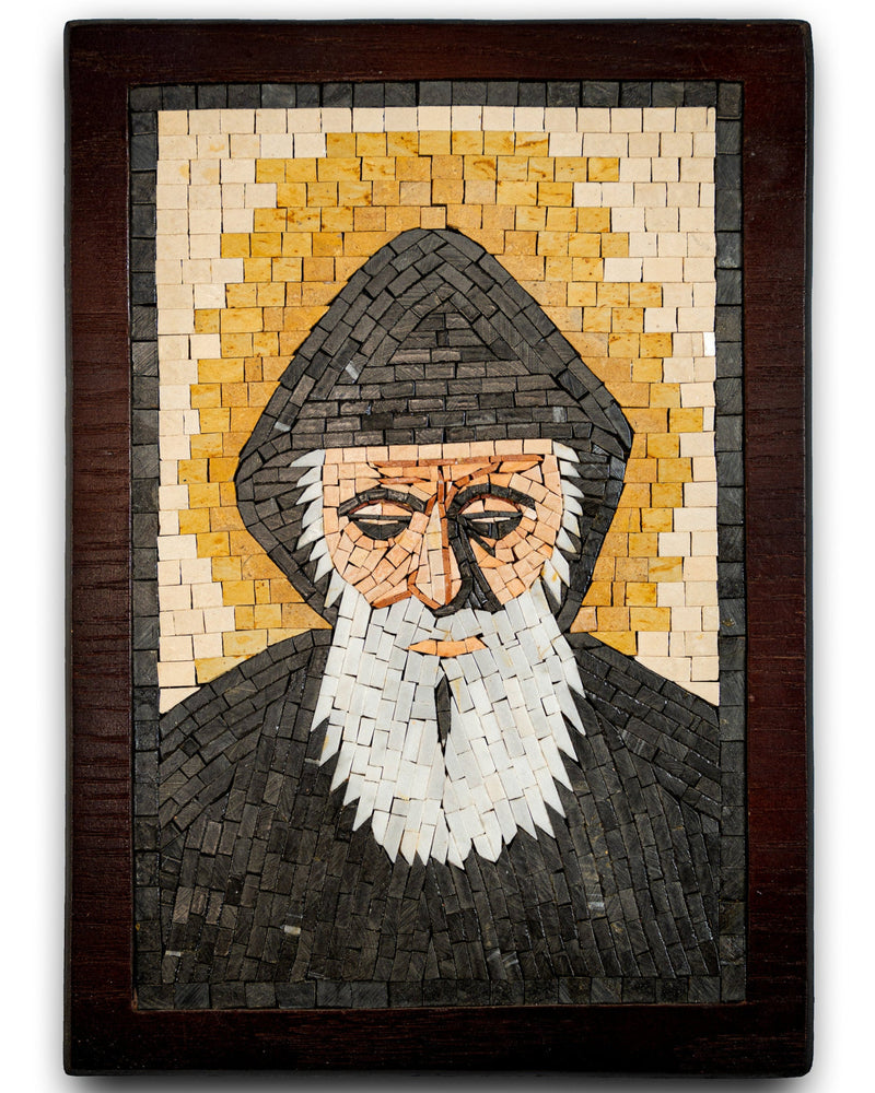 Intricate mosaic artwork depicting a wise figure with a hood and white beard, set against a golden halo background.