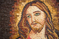 Intricate mosaic artwork depicting a serene face with flowing hair and striking green eyes, set against a textured background.