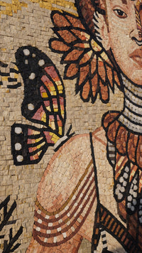 Intricate mosaic artwork featuring a woman adorned with tribal jewelry and a vibrant butterfly motif in warm tones.