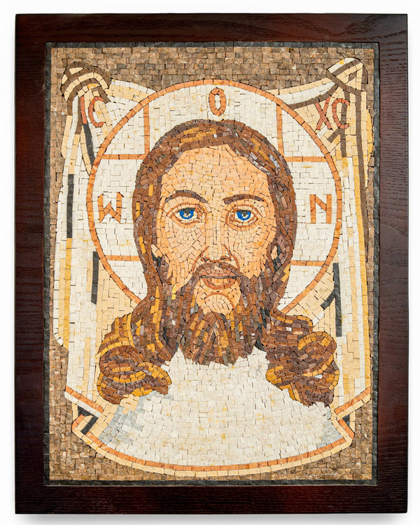 Intricate mosaic artwork depicting Jesus Christ with striking blue eyes and detailed facial features on a wooden frame