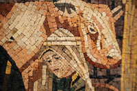 Intricate mosaic artwork featuring a woman and cow, with earthy tones and textured stone pieces creating a vivid scene