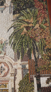 Intricate mosaic wall art featuring vibrant green palm leaves and earthy tones — a stunning depiction of nature's beauty.