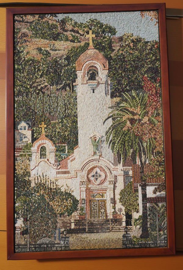 Intricate mosaic artwork depicting a serene church surrounded by lush greenery — vibrant colors and detailed textures enhance the scene.