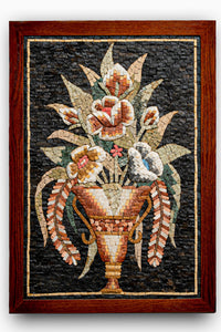 Intricate mosaic wall art featuring a floral arrangement in a wooden frame — vibrant colors create a stunning visual effect.