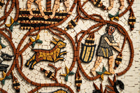 Intricate mosaic artwork featuring a man with a barrel and a dog, crafted from colorful ceramic tiles on a textured background