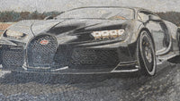 Intricate mosaic artwork depicting a sleek Bugatti sports car in shades of gray with detailed tire textures and reflections.