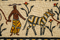 Intricate mosaic artwork featuring a figure with a patterned garment beside a striped animal — vibrant colors and detailed craftsmanship