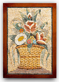 Intricate mosaic wall art featuring a woven basket overflowing with colorful flowers — detailed craftsmanship in natural stone.