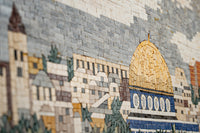 Intricate mosaic artwork depicting a historic city skyline with detailed stone textures and vibrant colors.