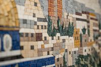 Intricate mosaic artwork featuring a landscape of buildings and greenery — crafted with vibrant ceramic tiles for a textured finish