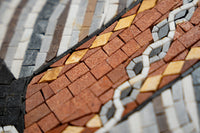Intricate mosaic tile design featuring earthy tones of brown, gray, and cream — each piece carefully arranged for texture.