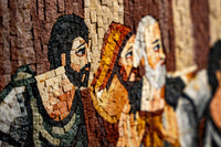 Intricate mosaic artwork depicting three men with distinct features and textures, showcasing detailed craftsmanship in earthy tones.