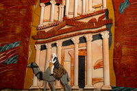 Intricate mosaic art featuring a camel and rider against a backdrop of ancient architecture — rich textures in earthy tones.