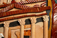 Intricate mosaic artwork featuring terracotta and cream tiles arranged in a geometric pattern — showcasing ancient architectural elements.