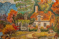 Colorful mosaic artwork depicting a quaint cottage surrounded by autumn foliage — intricate details capturing nature's beauty.
