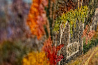 Intricate mosaic artwork featuring vibrant autumn colors and detailed textures that create a stunning visual depth